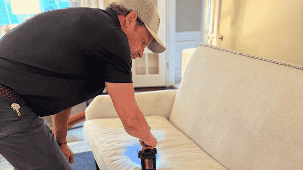 FiberCare technician cleaning upholstery in a Louisville home