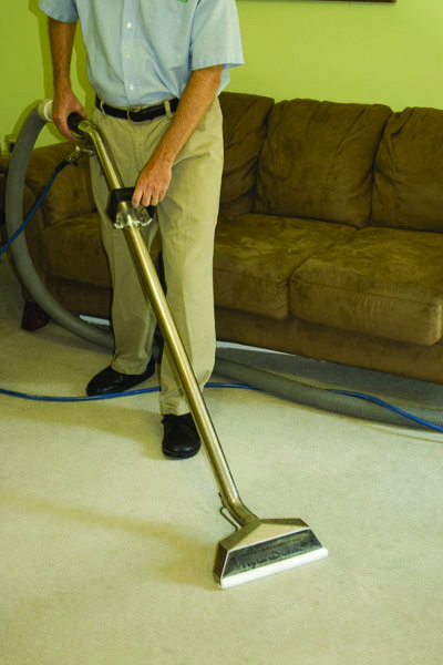 FiberCare hot water extraction wand in action on carpet